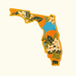 Embroidered patch of Florida with floral design on a white background